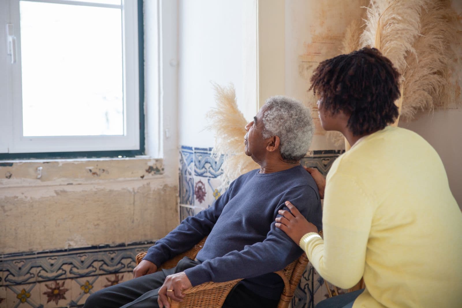 A Keystone caregiver comforting a senior client at home