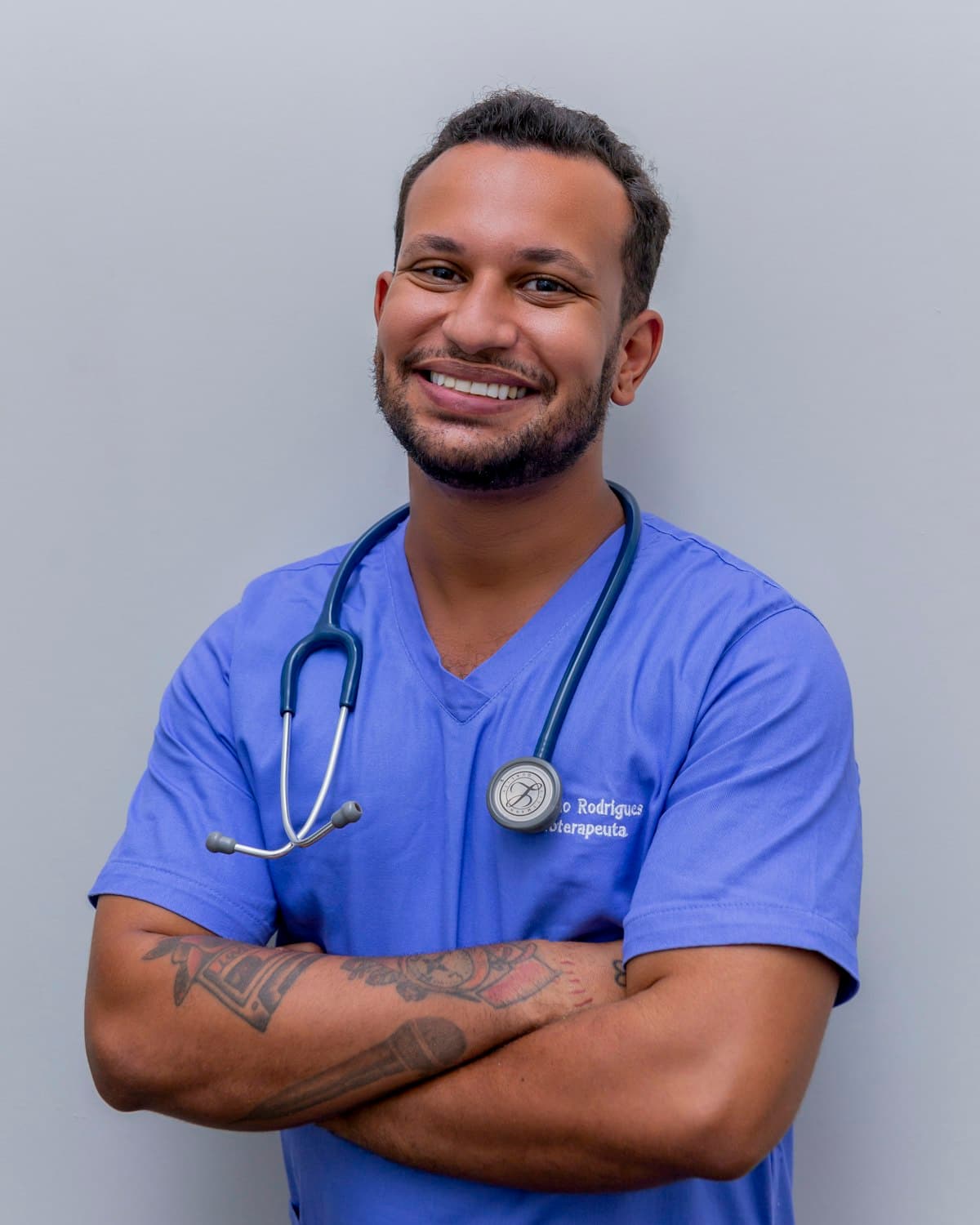 A smiling Keystone nurse in scrubs
